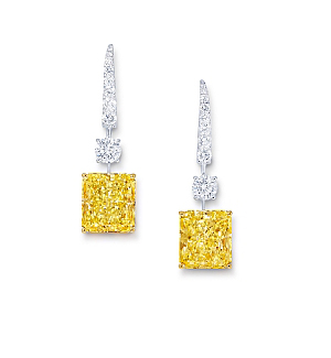 Two trails of white diamonds elegantly lead the eye to radiant-cut yellow stones in this pair of earrings set to hit the Hamptons. 