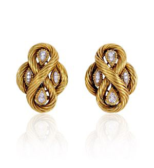 Van Cleef & Arpels makes several appearances in the calendar, including with these knotted gold and diamond earrings.