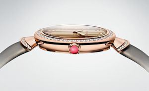 The crowns of the Diva watches are set with a  pink rubellite.