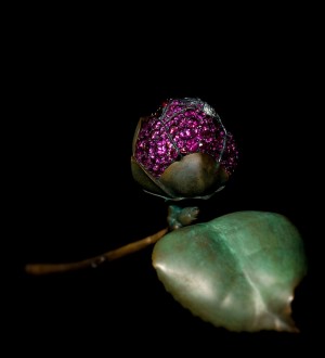 "Camellia Brooch," 2010. Rubies, pink sapphires, diamonds, silver, and gold. Private collection. Photograph by Jozsef Tari; courtesy of JAR, Paris.