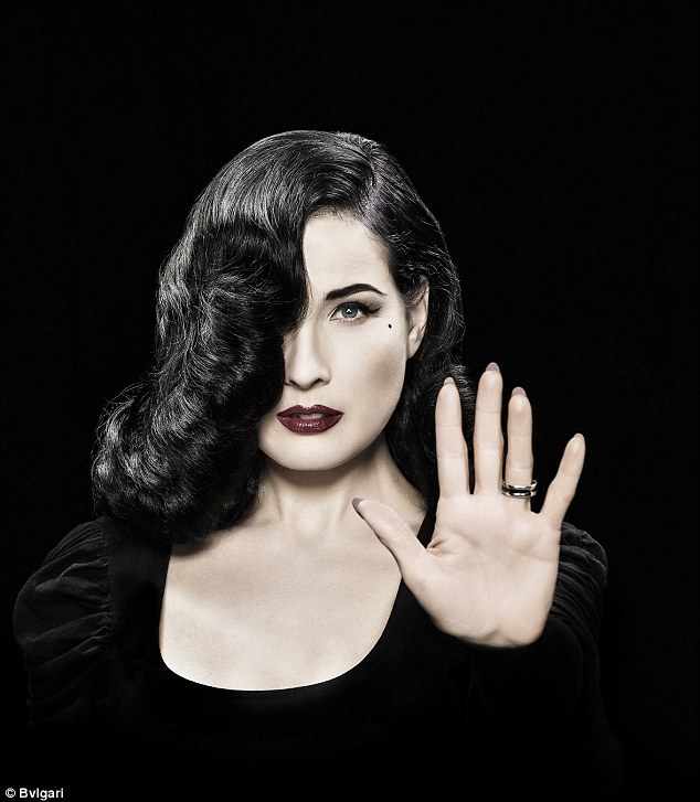 Dancer and model Dita Von Teese shows her Save the Children ring from Bulgari. Photo courtesy: Bulgari.