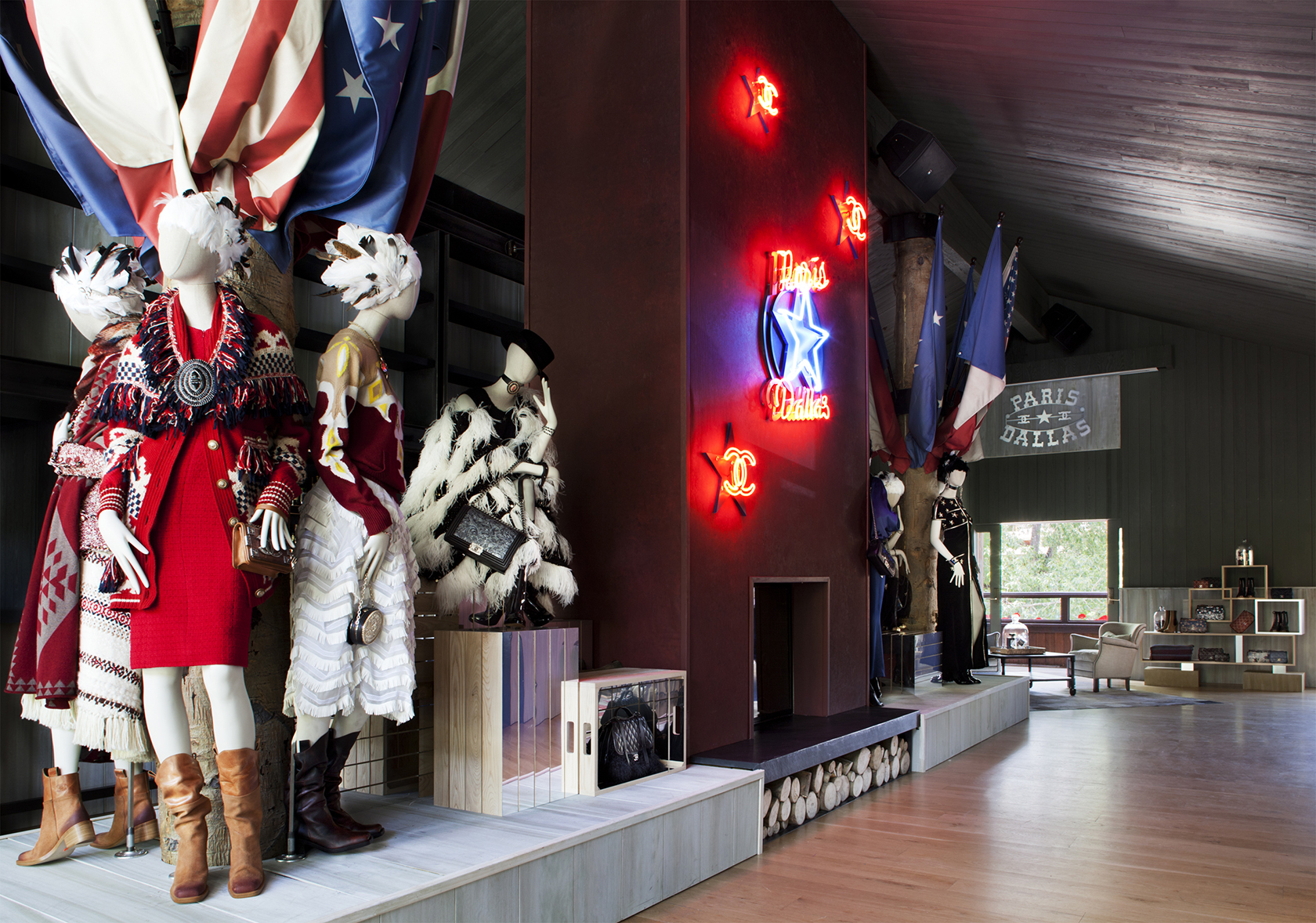 Illuminated Chanel signs display with a red Texas star at the new boutique's entrance. Karl Lagerfeld found inspiration from the American west for his new collection.