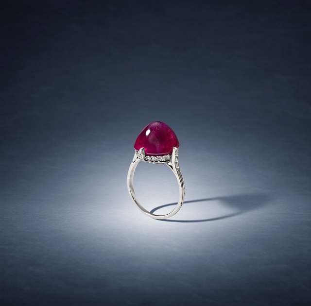 A cabochon ruby sits atop Van Cleef & Arpels's delicate, diamond-spotted ring. Photos courtesy Bonhams.