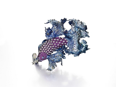 Gleams of Waves. With yellow diamonds, ruby and pink sapphire, the colorful fish is an exploration in existence. 