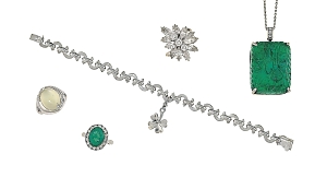 Among the dazzling Christie's offerings displayed here is a classic Chanel bracelet (center). Featuring signature "C" links, the piece — better known as Lot 235 — is estimated to draw a bid of upwards of $2,745.