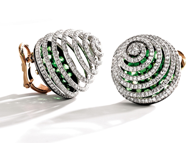 A bidding war could erupt at Sotheby's New York over this exquisite set of JAR earclips featuring approximately 5.00 carats of diamonds spiraling above demantoid garnets. Photos courtesy Sotheby's. 