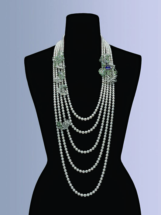 In addition to feathers, the Plumage necklace contains accents of diamonds, sapphires, and Paraiba tourmaline.