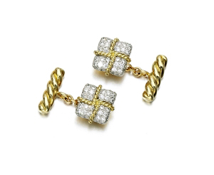 Verdura's cufflinks exude elegance with brilliant-cut diamonds and a classic rope design.  