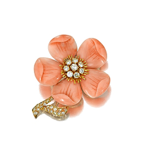 A carved coral flower is enhanced by circular-cut diamonds in this brooch by Van Cleef & Arpels, one of Fine Jewelry's 215 lots. 
