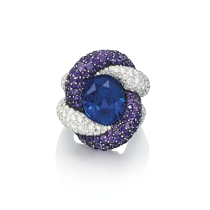 Spectacular diamond and amethyst cords hold an oval-shapped sapphire in this ring by JAR from 1988. 