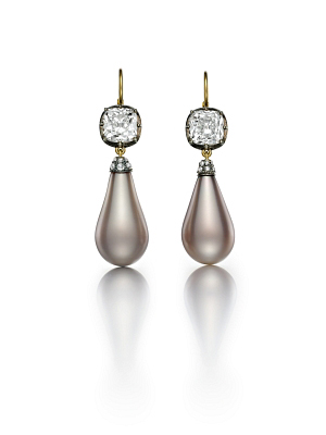 The Empress Eugenie Pearls set in a pair  of  earrings.  Each pearl  is suspended from a 3.01 carat gold mine brilliant cut diamond. Photo courtesy of Siegelson.