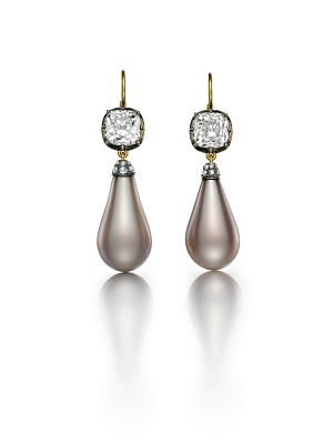 The Empress Eugenie Pearls set in a pair of earrings. Each pearl is suspended from a 3.01 carat gold mine brilliant cut diamond. Photo courtesy of Siegelson.