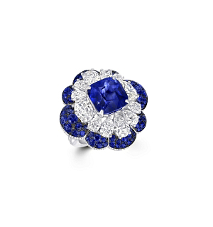 Sapphires dance in the light alongside oval-, round-, and pear-shaped diamonds in a second variation of the mesmerizing ring. 