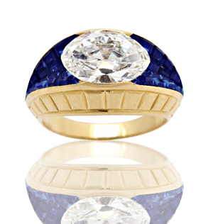 An approximately 2.09-carat diamond is nestled amongst vibrant sapphires in this Van Cleef & Arpels ring from exhibitor Pat Saling.