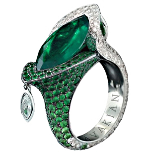 A striking 11.5 carat Colombian emerald marquise ring set with diamonds.