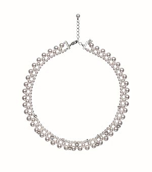 The Flower Lace necklace features a delicate lace design.