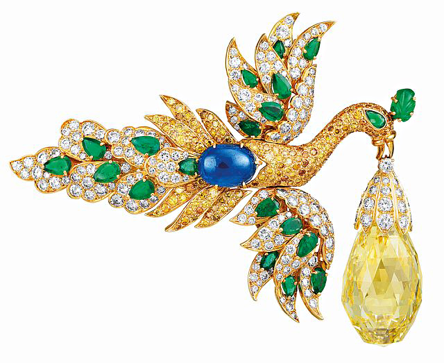 Brooches have only one pin, whereas clips — like this emerald, sapphire, and diamond stunner from the 1970s — have two. Photos courtesy Van Cleef & Arpels.