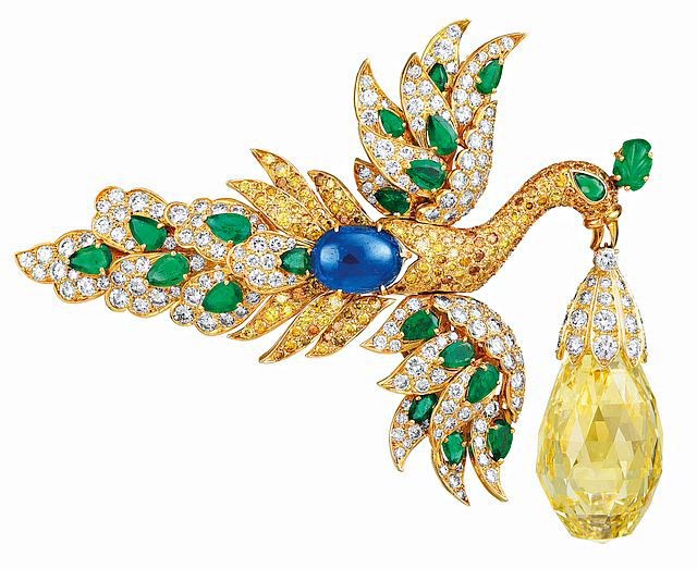 Brooches have only one pin, whereas clips — like this emerald, sapphire, and diamond stunner from the 1970s — have two. Photos courtesy Van Cleef & Arpels. 