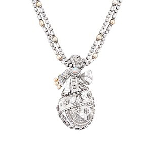 A removable egg pendant gives this breathtaking necklace added intrigue. 