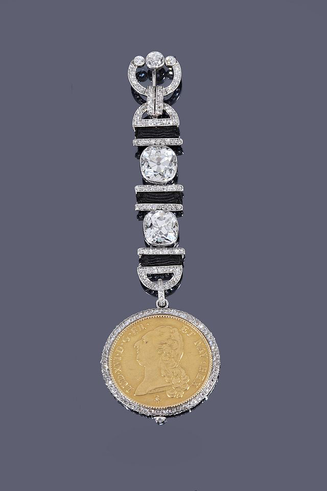 Lot 122. A highlight of the Cartier selections includes this Belle Epoque diamond set lapel pin with watch fob, circa 1920. Images courtesy Dreweatt's.