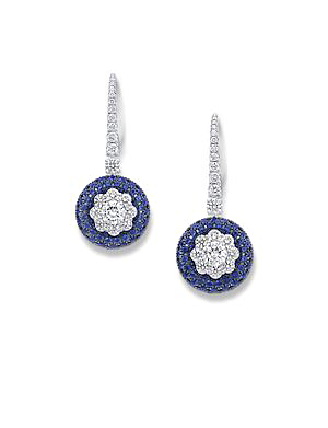There are two designs within the Halo collection. Here, the central stone is encased by diamonds in a floral arrangement, but an alternate version features a shower of gems fanning out immediately from the focal diamond.