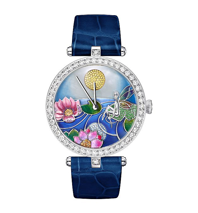 Suspended above the watch’s rotating, blue landscape is flora formed from tsavorite garnets, sapphires, spessarite garnets and enamel. Photos courtesy Van Cleef & Arpels.