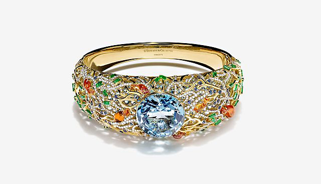 With an aquamarine center stone, the detail on this gold bracelet is designed to mimic an underwater garden. Photo courtesy Tiffany & Co. 