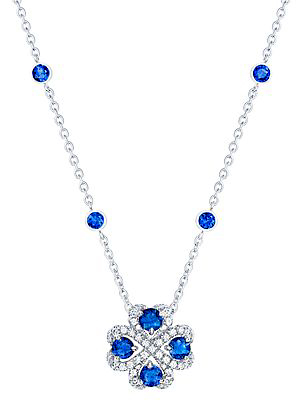 The pendant’s white gold chain is set with additional bright stones. 