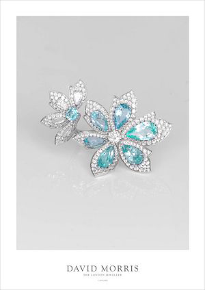 Paraiba tourmaline Palm Flower ring incorporating an11.5 carat Paraiba tourmaline with 6.3 carats of brilliant cut white diamonds set in 18 carat white gold.